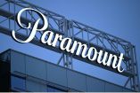 (FILES) (COMBO) This combination of files pictures created on December 22, 2025 shows the Paramount logo (TOP) displayed at Columbia Square along Sunset Blvd in Hollywood, California on March 9, 2023 and the WB logo on the exterior of Warner Bros. Studios, Burbank in Burbank, California on October 21, 2025. Paramount Skydance completed its $110 billion takeover of Warner Bros. Discovery on October 6, 2026, creating a new Hollywood heavyweight called Skydance and giving CEO David Ellison control of one of the worlds largest entertainment companies in a deal set to reshape the media landscape. (Photo by Patrick T. Fallon and Robyn Beck / AFP)
