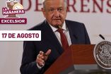 AMLO de traje y corbata roja con el rostro serio
