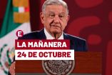AMLO de traje azul con el rostro serio