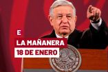 AMLO de traje negro y corbata azul con rojo en una de sus conferencias
