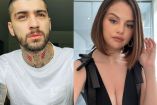 Selena Gomez con vestido negro, mano en cabeza y Zayn Malik con playera blanca