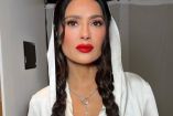 Salma Hayek con sudadera blanca y peinado de trenzas