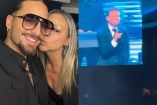 Maluma con lentes abrazando a su mamá en concierto de Luis Miguel