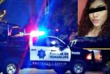 Patrulla estacionada afuera de la casa de una joven de 22 años asesinada de un balazo