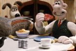 Wallace y Gromit cenando en mesa