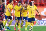 Jugadores del América celebrando un gol.