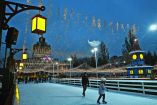 Visitors skate on an ice-skating ring during Christmas Fair at the Ukrainian National Exhibition Center in Kyiv on December 21, 2025, amid Russian invasion in Ukraine. (Photo by Sergei SUPINSKY / AFP)