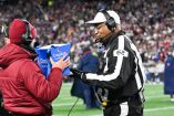 Jan 11, 2026; Foxborough, MA, USA; Referee Ron Torbert (62) reviews a play during the second quarter between the New England Patriots and the Los Angeles Chargers in an AFC Wild Card Round game at Gillette Stadium. Mandatory Credit: Eric Canha-Imagn Images