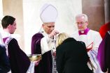 Pope Leo XIV puts ash on a faithful's head during the Ash Wednesday Mass at the Santa Sabina Basilica in Rome, Italy, February 18, 2026. REUTERS/Remo Casilli     TPX IMAGES OF THE DAY