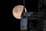 The Moon sets behind NASA’s Artemis II SLS (Space Launch System) rocket and Orion spacecraft atop a mobile launcher at Launch Complex 39B at NASA’s Kennedy Space Center in Florida during the Artemis II wet dress rehearsal on Sunday, Feb. 1, 2026.