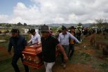 Friends and family carry the coffin of Royer Perez-Jimenez, a Mexican migrant who died on March 16, 2026, at an ICE detention center in Florida, at a cemetery in San Juan Chamula, Chiapas, Mexico, April 4, 2026. REUTERS/Gabriela Zanabria     TPX IMAGES OF THE DAY