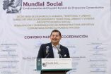 Alejandro Armenta Mier habla en evento del Mundial Social en Puebla frente a autoridades durante firma de comité estatal de proyectos comunitarios.