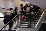 FBI and DEA personnel walk at the venue, following a shooting incident during the annual White House Correspondents' Association dinner, in Washington, D.C., U.S., April 25, 2026. REUTERS/Ken Cedeno
