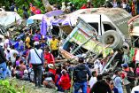 People remain at the site of an explosion after a bomb attack at El Tunel, on the Popayan-Cali road, in Cajibio, Cauca department, Colombia, on April 25, 2026. A bomb attack on April 25 left seven people dead and 20 injured in an area of Colombia with a strong guerrilla presence, amid a spate of attacks just over a month before the presidential elections, the governor of the Cauca region said. (Photo by Joaquin SARMIENTO / AFP)