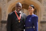 British actor Idris Elba poses with his wife Sabrina Dhowre Elba and his medal after being appointed as a Knight Bachelor (Knighthood) for services to young people at an investiture ceremony at Windsor Castle on June 2, 2026. (Photo by Andrew Matthews / POOL / AFP)