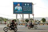 Valla publicitaria con la imagen del líder hutí Abdul Malik al-Houthi en Saná, la capital yemení.