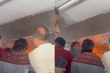 Un video muestra llamas en un compartimento superior del avión,