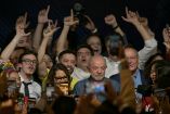 Brazil's President and re-election candidate for the Workers' Party (PT) Luiz Inacio Lula da Silva reacts after knowing the first results of the presidential runoff election, in Sao Paulo, Brazil, on October 25, 2026. Lula da Silva pulled off a dramatic comeback on October 25, 2026, as he clinched election victory against right-wing senator Flavio Bolsonaro, who trounced him in the first round. (Photo by NELSON ALMEIDA / AFP)