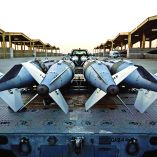 In this US Army photo released on December 19, 2025 and taken from an undisclosed location on December 18, 2025, US Airmen prepare to load GBU-31 munition systems onto F-15E Strike Eagles within the US Central Command area of responsibility, in support of Operation Hawkeye Strike. US forces struck more than 70 Islamic State group targets in Syria on Friday in what President Donald Trump described as "very serious retaliation" for an attack that killed three Americans last weekend. (Photo by US AIR FORCE / AFP) / RESTRICTED TO EDITORIAL USE - MANDATORY CREDIT "AFP PHOTO / US AIR FORCE" - HANDOUT - NO MARKETING NO ADVERTISING CAMPAIGNS - DISTRIBUTED AS A SERVICE TO CLIENTS