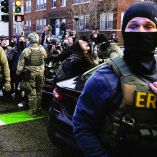 A woman reacts after beign dragged away from her car by federal agents who ordered her to leave the scene during an immigration raid, days after an ICE agent fatally shot Renee Nicole Good, in Minneapolis, Minnesota, U.S., January 13, 2026. REUTERS/Ryan Murphy     TPX IMAGES OF THE DAY