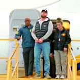 Ryan Wedding, a Canadian former Olympic snowboarder accused of becoming a cocaine smuggling kingpin linked to multiple drug-related murders, is escorted by FBI agents as he arrives handcuffed at Ontario International Airport, in California, U.S., January 23, 2026, in this screengrab taken from video.  FBI/Handout via REUTERS    THIS IMAGE HAS BEEN SUPPLIED BY A THIRD PARTY     TPX IMAGES OF THE DAY