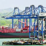 (FILES) Shipping containers of the Danish company Maersk are being moved at the port of Balboa in Panama City on February 12, 2026. The Panamanian courts concluded the legal proceedings that annulled the concession granted to Hong Kong-based CK Hutchison Holdings to operate two ports on the canal, publishing the ruling on February 23, 2026. (Photo by MARTIN BERNETTI / AFP)