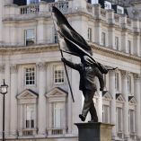 A statue depicting a person stepping off the plinth while carrying a flag covering their face, by British street artist Banksy, stands in London, Britain, April 30, 2026. REUTERS/Jack Taylor