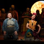 Carlos Alvarez as Diego Rivera and Isabel Leonard as Frida Kahlo perform on stage during a dress rehearsal of Gabriela Lena Frank's "El Ultimo Sueno de Frida y Diego" at the Metropolitan Opera House in New York, on May 11, 2026. At the foot of a gnarled red tree, their silhouettes framed by blue curtains, Diego Rivera dies in Frida Kahlos arms: the scene, which could be taken from one of the painters canvases, brings to a close an opera dedicated to the tumultuous relationship between the two artists. "El Ultimo Sueno de Frida y Diego" (The Last Dream of Frida and Diego), sung in Spanish, premieres at the Metropolitan Opera in New York on May 14, ahead of an international cinema release on May 30. (Photo by TIMOTHY A. CLARY / AFP)