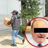 Personal de la Semar cargan documentos de investigación. En un círculo Ernesto Ruffo.