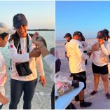Personal y voluntarios sostienen flamencos durante una jornada de anillamiento en un humedal de Yucatán para monitorear la especie.