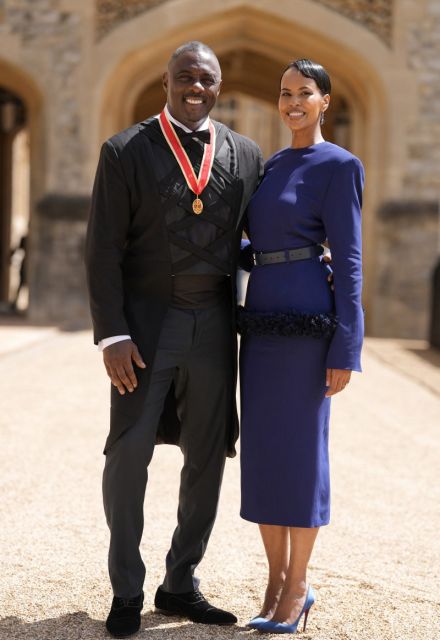 British actor Idris Elba poses with his wife Sabrina Dhowre Elba and his medal after being appointed as a Knight Bachelor (Knighthood) for services to young people at an investiture ceremony at Windsor Castle on June 2, 2026. (Photo by Andrew Matthews / POOL / AFP)