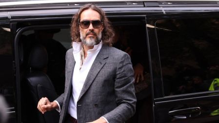British comedian and actor Russell Brand arrives for the start of his trial at Southwark Crown Court in south London on October 12, 2026, after pleading not guilty to three charges of rape, indecent assault, and three counts of sexual assault. (Photo by Brook Mitchell / AFP)