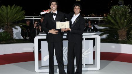 Spanish director, screenwriter and producer Javier Calvo (L) and Spanish director, screenwriter and producer Javier Ambrossi pose with the trophy during a photocall after winning ex-aequo the Best Director Prize for the film "La Bola Negra" during the closing ceremony of the 79th edition of the Cannes Film Festival in Cannes, southern France, on May 23, 2026. (Photo by Thibaud MORITZ / AFP)
