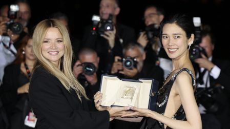 Belgian actress Virginie Efira (L) and Japanese actress Tao Okamoto pose with the trophy during a photocall after winning ex-eaquo the Best Actress Prize for the film "Soudain" (All of a Sudden) during the closing ceremony of the 79th edition of the Cannes Film Festival in Cannes, southern France, on May 23, 2026. (Photo by Thibaud MORITZ / AFP)