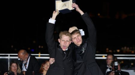 French actor Valentin Campagne (L) and Belgian actor Emmanuel Macchia pose with the trophy during a photocall after winning ex-aequo the Best Actor Prize for the film "Coward" during the closing ceremony of the 79th edition of the Cannes Film Festival in Cannes, southern France, on May 23, 2026. (Photo by Thibaud MORITZ / AFP)