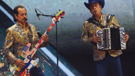 Band Los Tigres del Norte perform onstage during the 26th Annual Latin Grammy Awards at the MGM Grand Garden Arena in Las Vegas, Nevada on November 13, 2025. (Photo by VALERIE MACON / AFP) / RESTRICTED TO EDITORIAL USE
