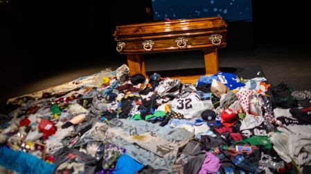 The coffin with the remains of Carlos Alberto "Indio" Solari, the iconic Argentine rock musician and former lead singer of Patricio Rey y sus Redonditos de Ricota, is pictured as fans queue to pay their respects at Villa Dominico, Buenos Aires Province, Argentina, on June 7, 2026. The singer died in Parque Leloir, Buenos Aires Province, on June 5 at the age of 77. (Photo by TOMAS CUESTA / AFP)
