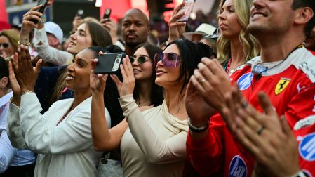 US reality TV personality Kim Kardashian (C) cheers during podium ceremony of the Monaco Formula 1 Grand Prix at the Monaco street circuit in Monaco, ahead of the, on June 7, 2026.  Andrej ISAKOVIC / AFP