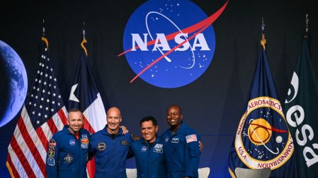 (L/R) NASA astronaut commander Randy Bresnik, ESA (European Space Agency) astronaut pilot Luca Parmitano, NASA astronaut mission specialist Frank Rubio, and NASA astronaut mission specialist Andre Douglas stand together onstage during a press conference announcing the crew for the Artemis III mission at NASA's Johnson Space Center in Houston, Texas, on June 9, 2026. The Italian Luca Parmitano will be the pilot of NASA's Artemis 3 voyage, the first European to join one of the program's missions. Parmitano, who will represent the European Space Agency, is one of four men named as crewmembers tasked with carrying out Artemis 3, which is targeting launch in late 2027. (Photo by RONALDO SCHEMIDT / AFP)