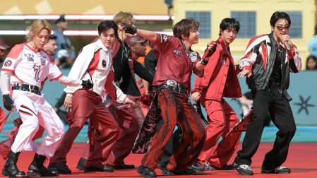 Members of the South Korean boy band BTS perform during the 2026 World Cup football tournament final match between Spain and Argentina at the New York/New Jersey Stadium in East Rutherford on July 19, 2026. (Photo by JUAN MABROMATA / AFP)