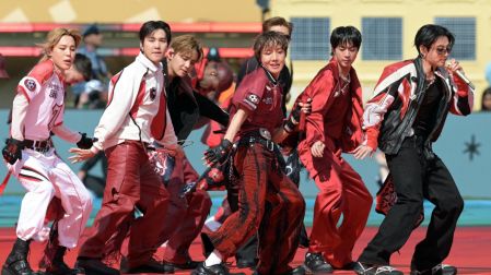 Members of the South Korean boy band BTS perform during the 2026 World Cup football tournament final match between Spain and Argentina at the New York/New Jersey Stadium in East Rutherford on July 19, 2026. (Photo by JUAN MABROMATA / AFP)