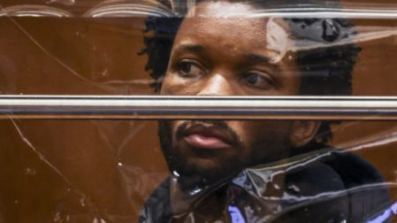 US singer D4vd is seen during his arraignment at Clara Shortridge Foltz Criminal Justice Center in Los Angeles, on April 20, 2026. Singer D4vd was charged Monday with the murder and dismemberment of a teenage girl whose decomposing body was found in an abandoned Tesla in the Hollywood Hills. The 21-year-old, whose real name is David Anthony Burke, appeared in court Monday to face multiple charges over the horrifying death of Celeste Rivas Hernandez, whose body was found in September, within days of what would have been her 15th birthday.Ted Soqui / POOL / AFP
