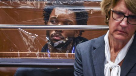 US singer D4vd is seen during his arraignment at Clara Shortridge Foltz Criminal Justice Center in Los Angeles, on April 20, 2026. Singer D4vd was charged Monday with the murder and dismemberment of a teenage girl whose decomposing body was found in an abandoned Tesla in the Hollywood Hills. The 21-year-old, whose real name is David Anthony Burke, appeared in court Monday to face multiple charges over the horrifying death of Celeste Rivas Hernandez, whose body was found in September, within days of what would have been her 15th birthday.Ted Soqui / POOL / AFP