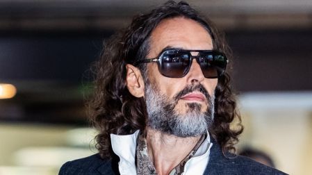 British comedian and actor Russell Brand leaves after jury selection finishes at the start of his trial at Southwark Crown Court in south London on October 12, 2026, after pleading not guilty to three charges of rape, indecent assault, and three counts of sexual assault. (Photo by Brook Mitchell / AFP)