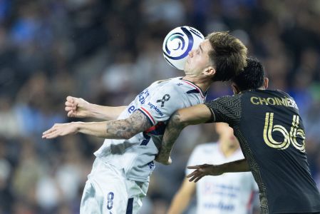 Agustin Palavecino (L) of Cruz Azul fights for the ball with Mathieu Choiniere (R) of Los Angeles during the Quarter Finals first leg match between Los Angeles FC and Cruz Azul as part of the CONCACAF Champions Cup 2026, at BMO Stadium, on April 07, 2026 in Los Angeles, California, United States.