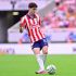 Brian Gutiérrez en un partido con Chivas