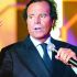 (FILES) Spanish singer Julio Iglesias sings during the Telethon television program in Paris on December 6, 2003. Two former employees of Julio Iglesias sue him before the Spanish justice, after denouncing in a journalistic investigation published this January 13, 2026 alleged assaults and sexual harassment by the Spanish singer. Legal sources confirmed to AFP that a complaint against Iglesias was filed on January 5 and is being examined. (Photo by Bertrand GUAY / AFP)