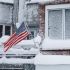 A U.S. flag waves during a winter storm in West New York, New Jersey, U.S., February 23, 2026. REUTERS/Eduardo Munoz