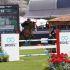 Un jinete compite en la pista del Longines Global Champions Tour México en Campo Marte, con presencia de marcas patrocinadoras y pantalla oficial del evento.