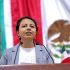 Diputada Liz Salgado Viramontes en tribuna del Congreso de la Ciudad de México durante sesión, con bandera de México al fondo